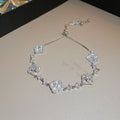 Four-petal zircon flower bracelet - elegant, adjustable, and trendy new jewelry