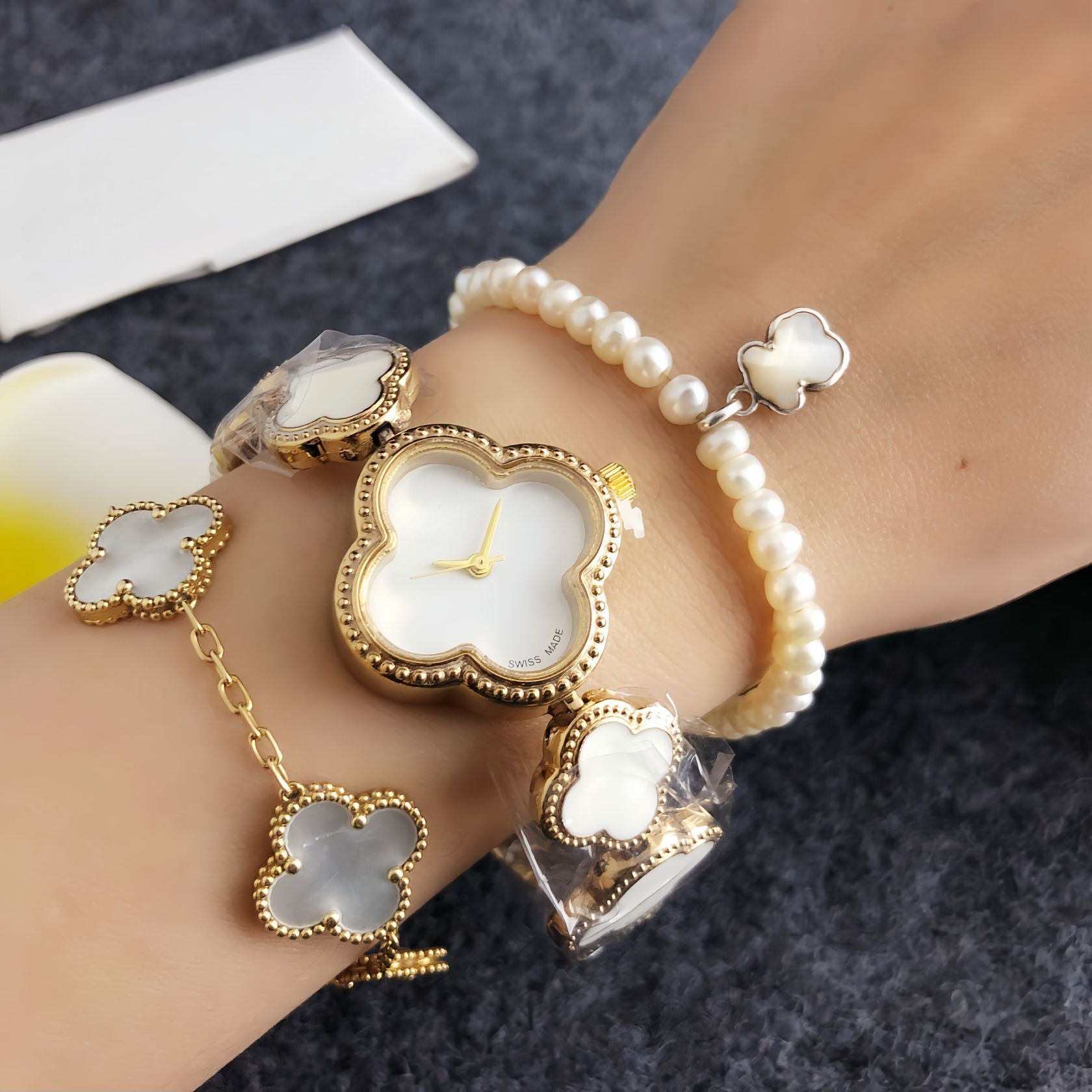 Four-leaf clover diamond-accented women's watch - silver case, black dial design - perfect for dates and commuting - elegant bracelet quartz wristwatch