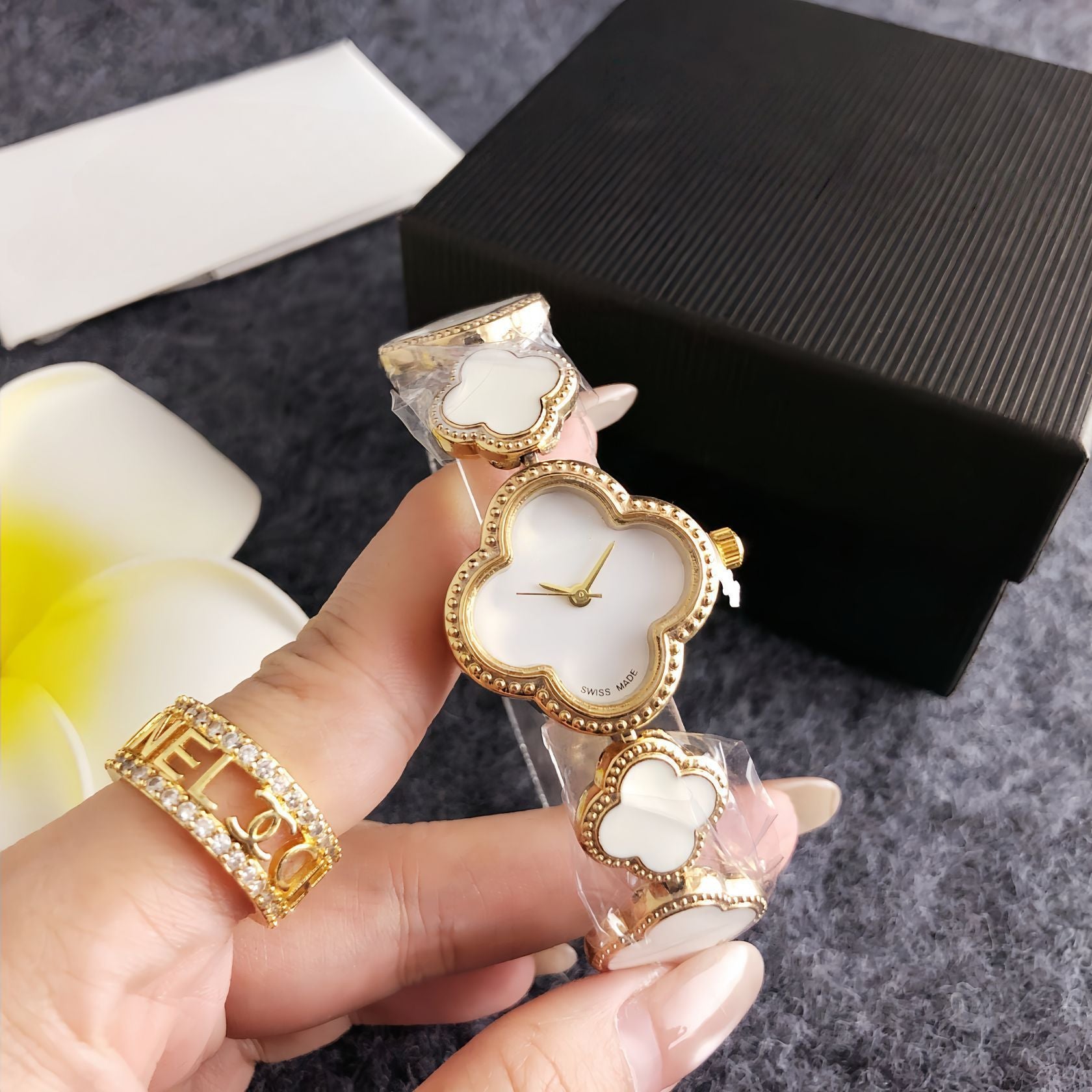 Four-leaf clover diamond-accented women's watch - silver case, black dial design - perfect for dates and commuting - elegant bracelet quartz wristwatch