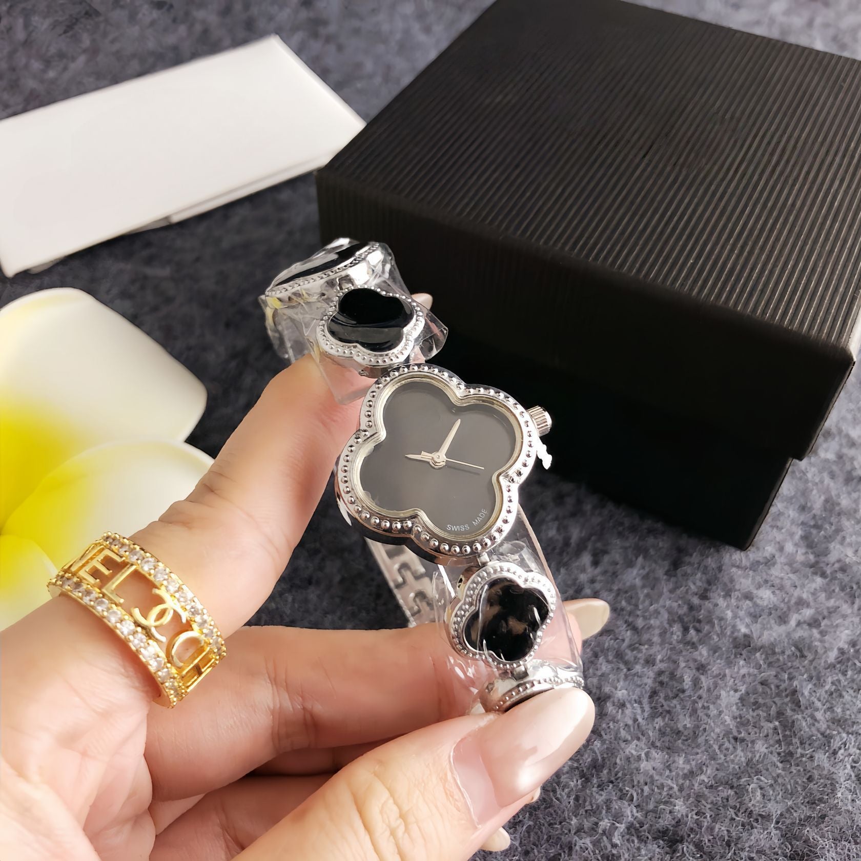 Four-leaf clover diamond-accented women's watch - silver case, black dial design - perfect for dates and commuting - elegant bracelet quartz wristwatch