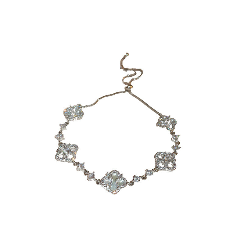 Four-petal zircon flower bracelet - elegant, adjustable, and trendy new jewelry