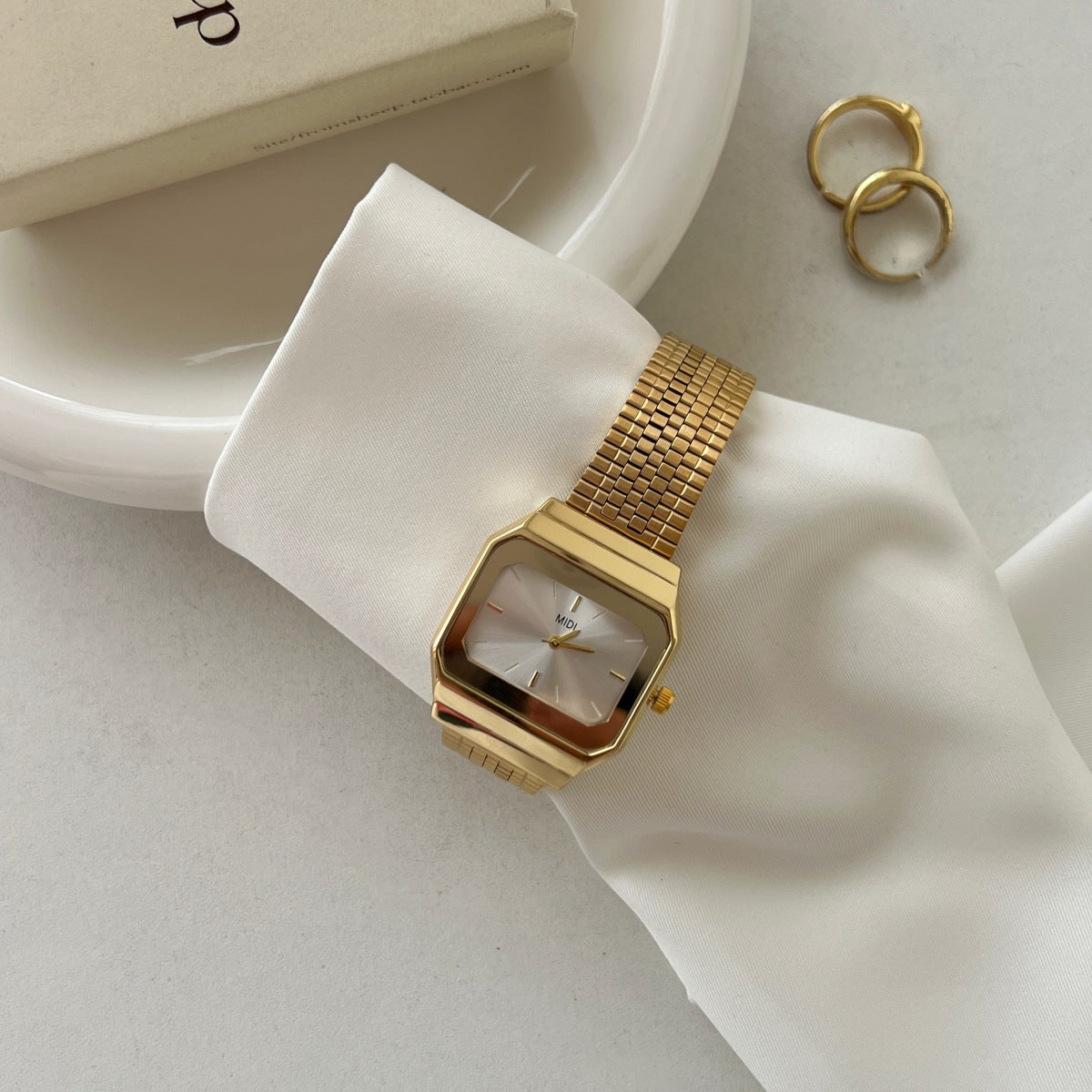 Gold-tone square watch for women - vintage-inspired, understated luxury, exquisite minimalist design