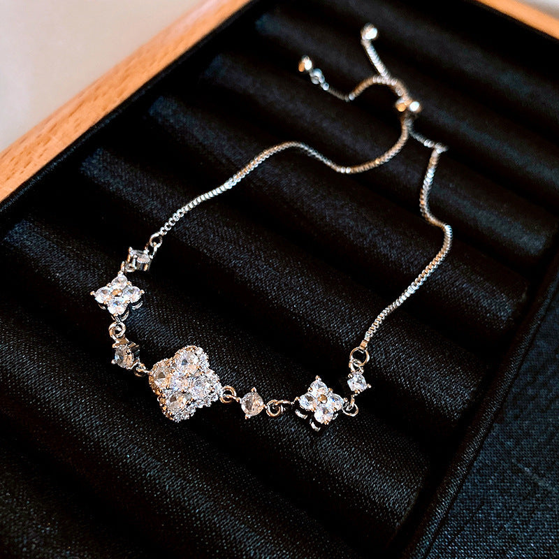 Four-petal zircon flower bracelet - elegant, adjustable, and trendy new jewelry