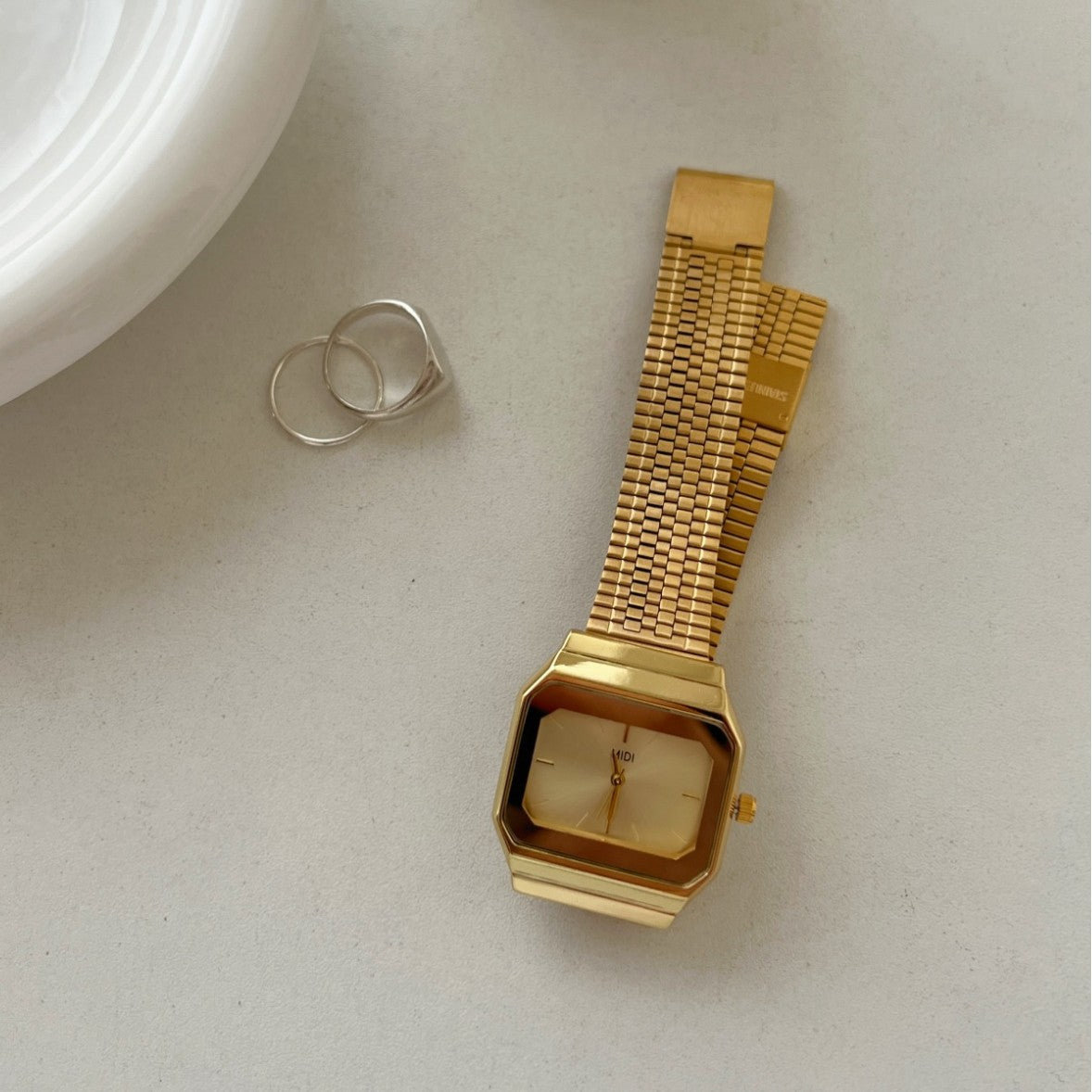 Gold-tone square watch for women - vintage-inspired, understated luxury, exquisite minimalist design